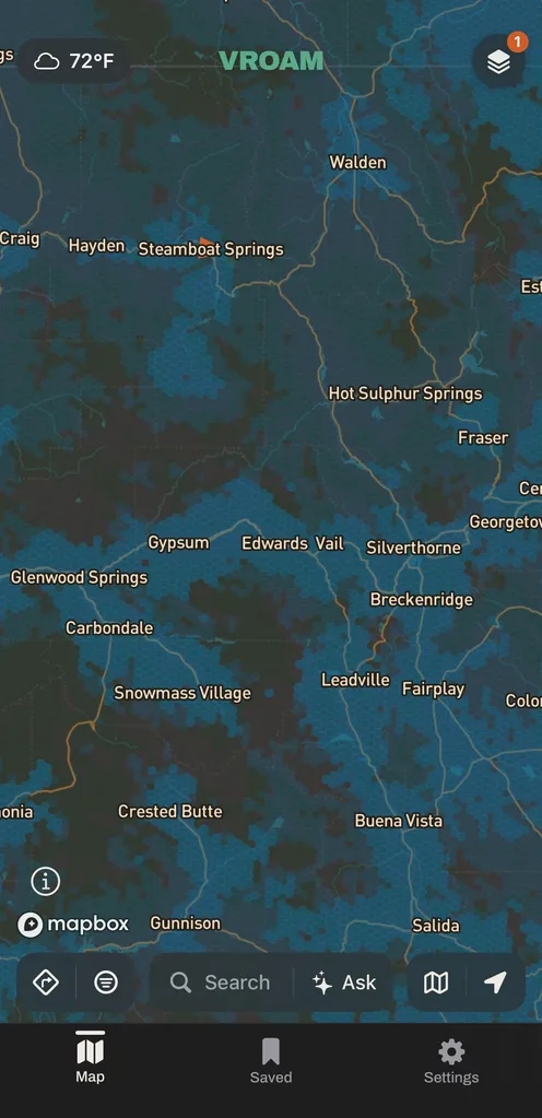 The same view of central Colorado with AT&T's modeled cell coverage in the carrier's blue, clustered tightly around Steamboat Springs, Glenwood Springs and the towns near Vail and Breckenridge, with wide dark gaps between them.