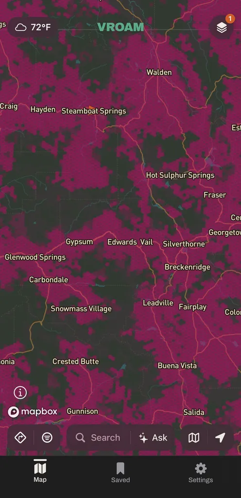 The same view of central Colorado with T-Mobile's modeled cell coverage in the carrier's magenta, covering most of the frame apart from dark unshaded pockets over the high country between Steamboat Springs and Vail.