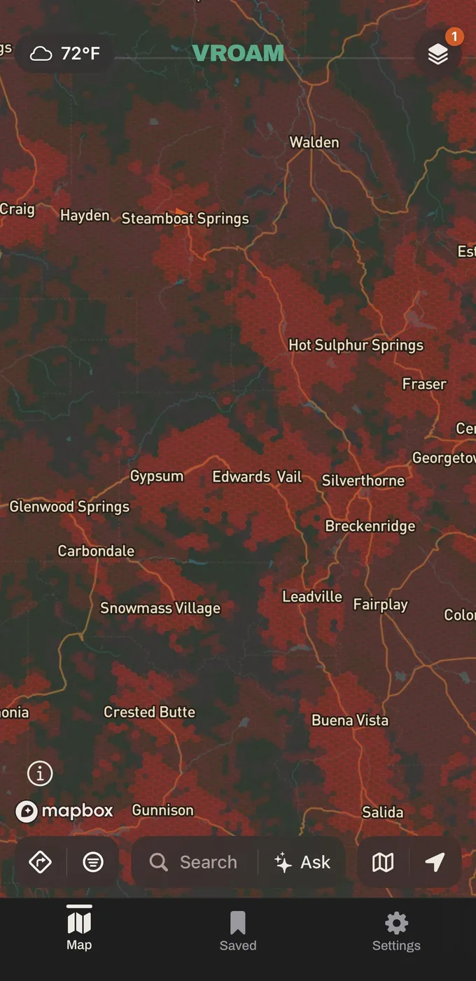 Vroam's map over central Colorado with Verizon's modeled cell coverage shaded in the carrier's red hexagons, dense through the mountain towns and dark where nothing is modeled.