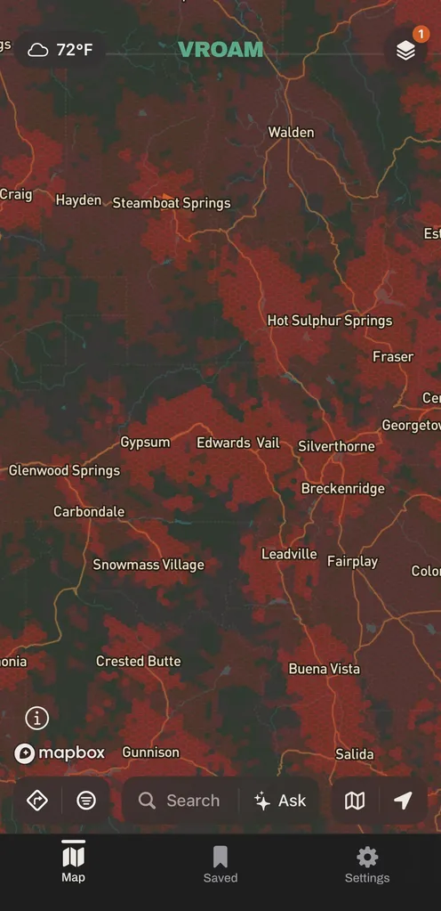 Vroam's map over central Colorado with Verizon's modeled cell coverage shaded in the carrier's red hexagons, dense through the mountain towns from Steamboat Springs down to Leadville, with dark unshaded ground left where nothing is modeled.