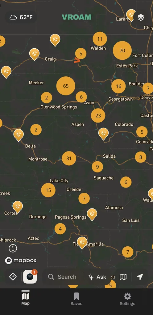 Vroam's map over Colorado with amber overnight parking pins and numbered cluster bubbles grouping nearby spots, from Fort Collins and Denver down through Durango.