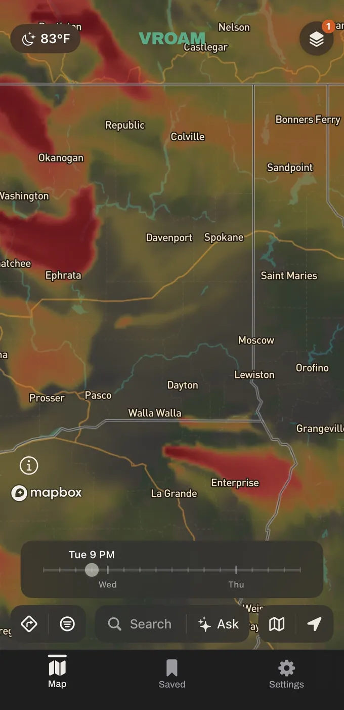 Vroam's smoke forecast over eastern Washington and northeast Oregon, deep red plumes fading through olive to clear air, with a time slider at the bottom reading Tuesday 9 PM.