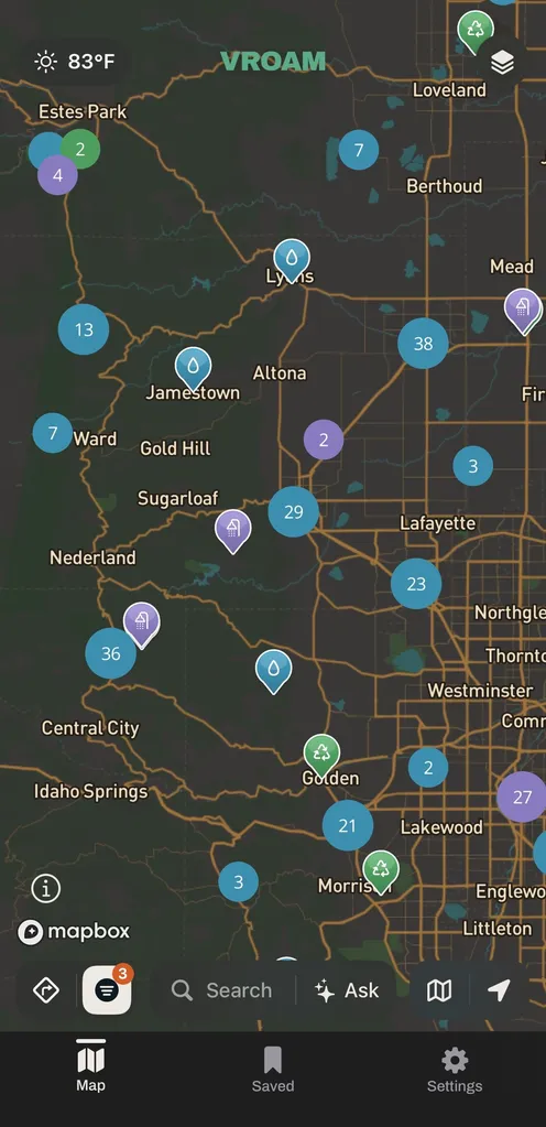 Vroam's map over Colorado's Front Range from Estes Park down to Littleton, with blue drop pins for drinking water, green pins for dump stations and purple pins for showers, and numbered bubbles grouping the ones that sit close together.